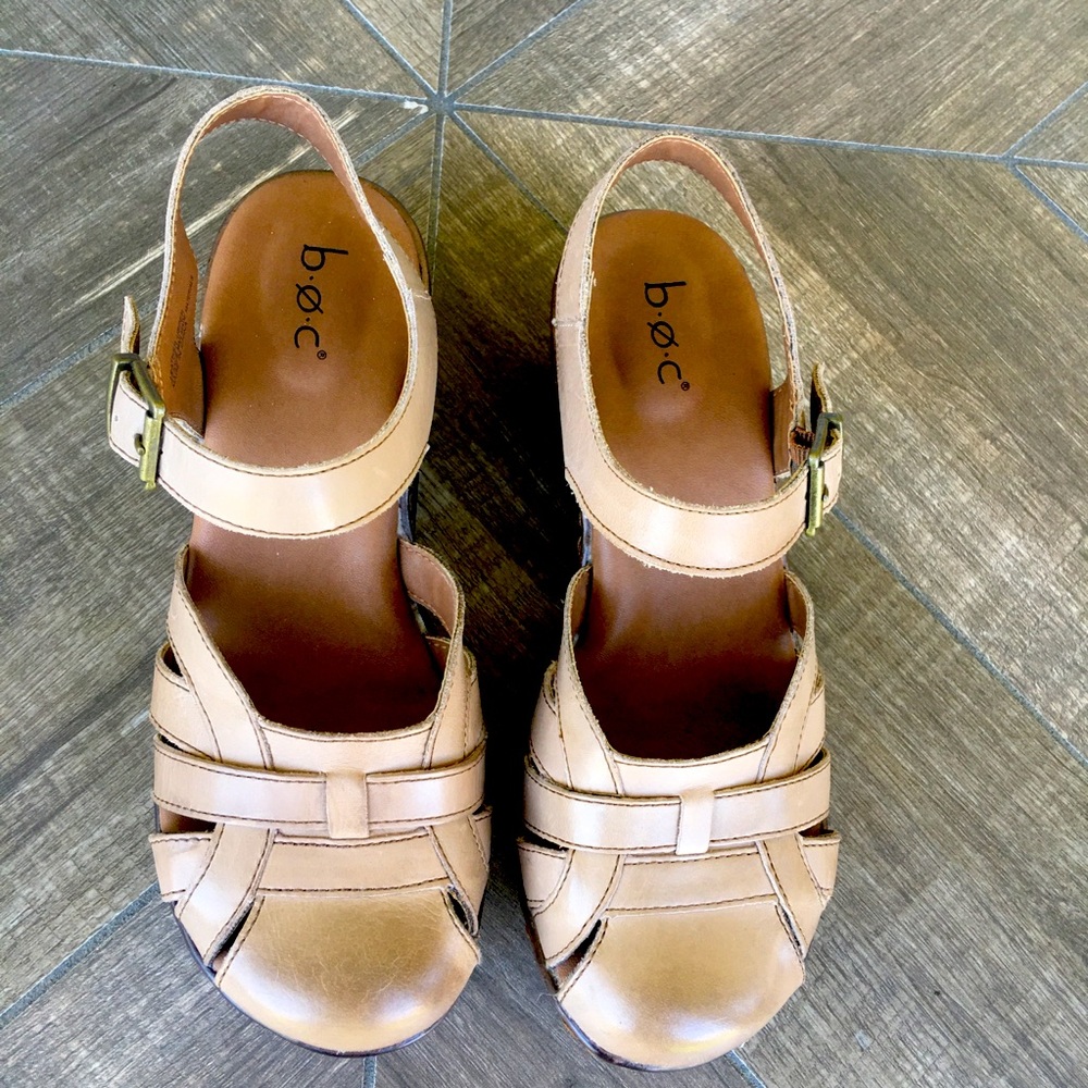 b o c close toed clogs with weaved design and square heels.